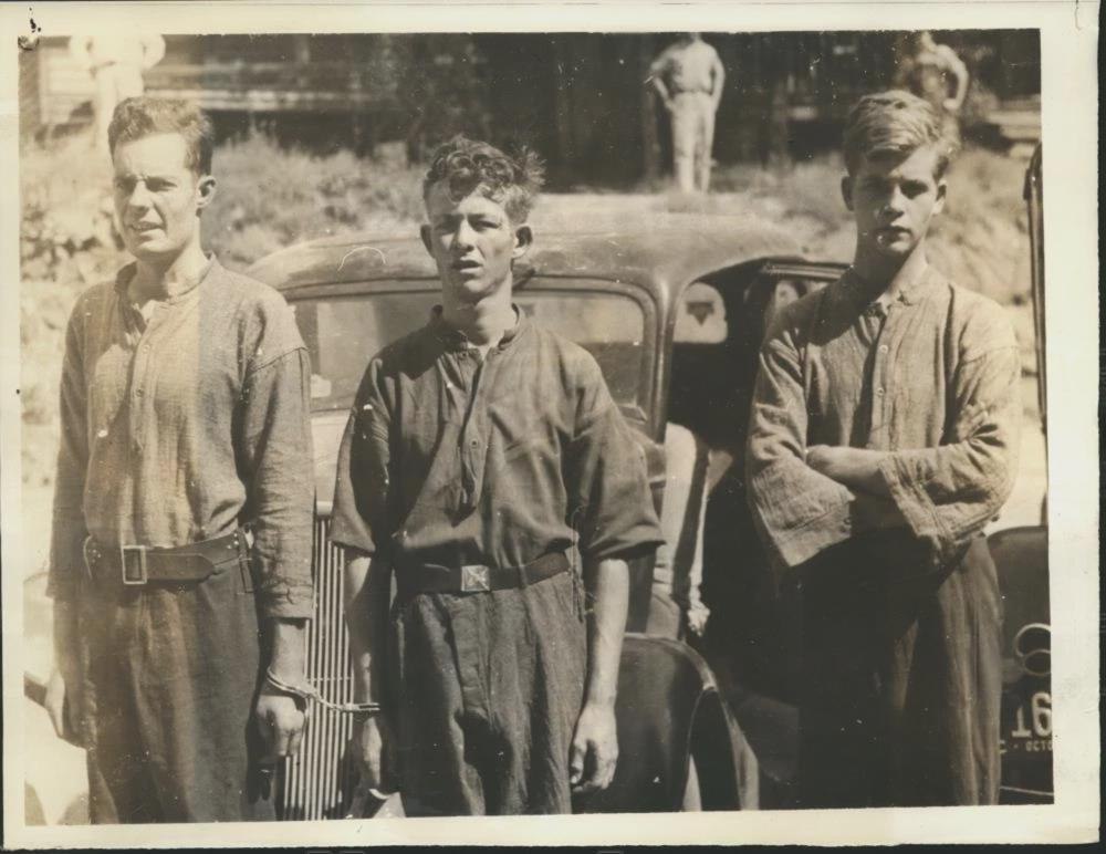 Hampton Lee, 24, Hugh Evans, 22, and Willis Evans, 18, are taken into custody fo...